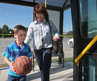 Child & Parent getting on the Bus